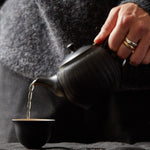 Pouring a freshly brewed cup of Somage tea